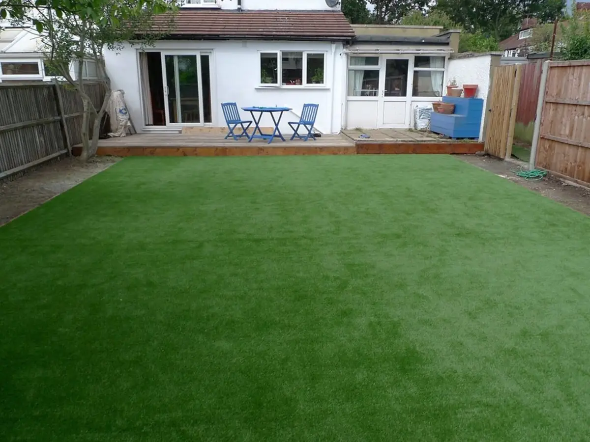 Clean artificial turf lawn with even, upright green fibers